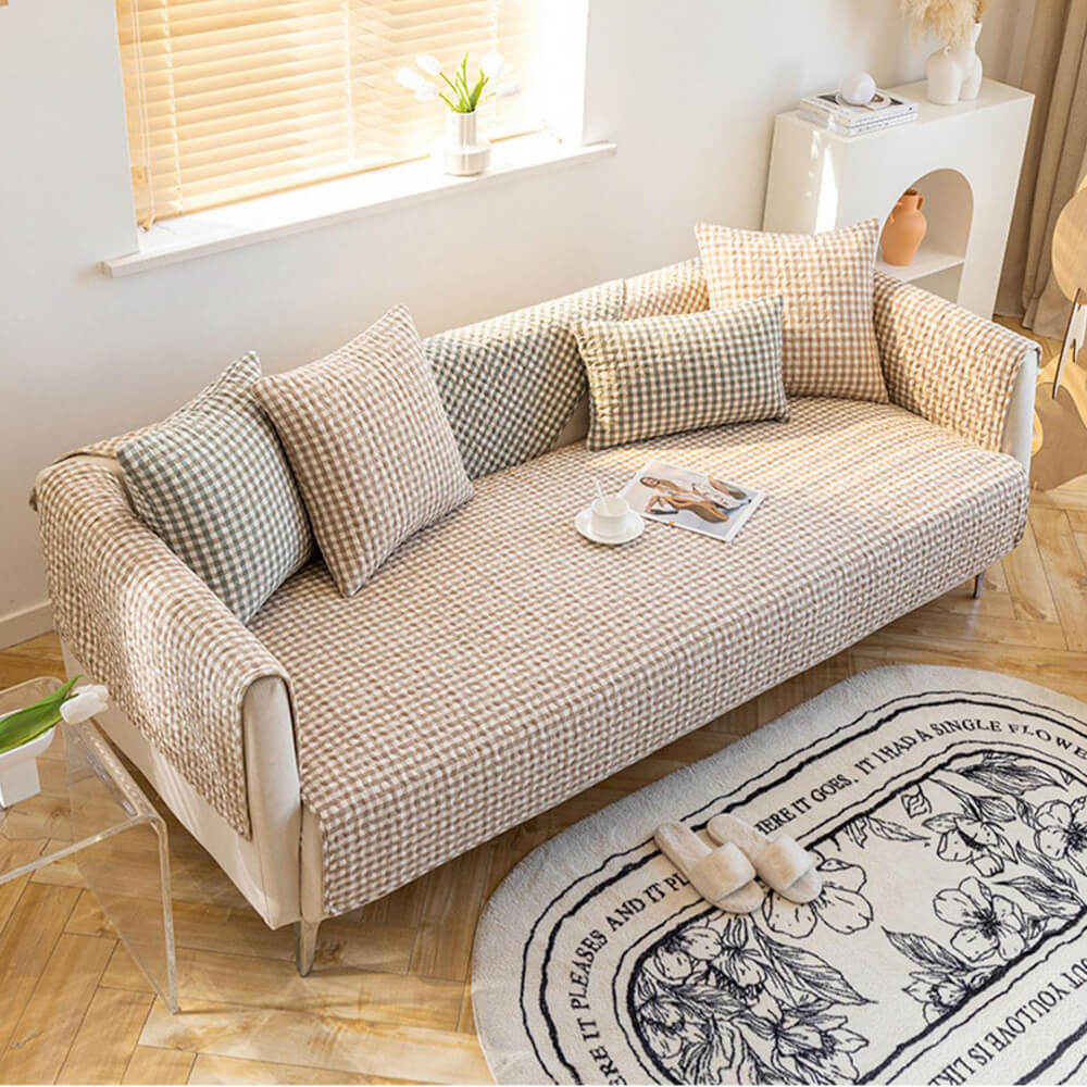 Close-up of retro plaid washed cotton sofa cover showing vibrant colors and fabric texture