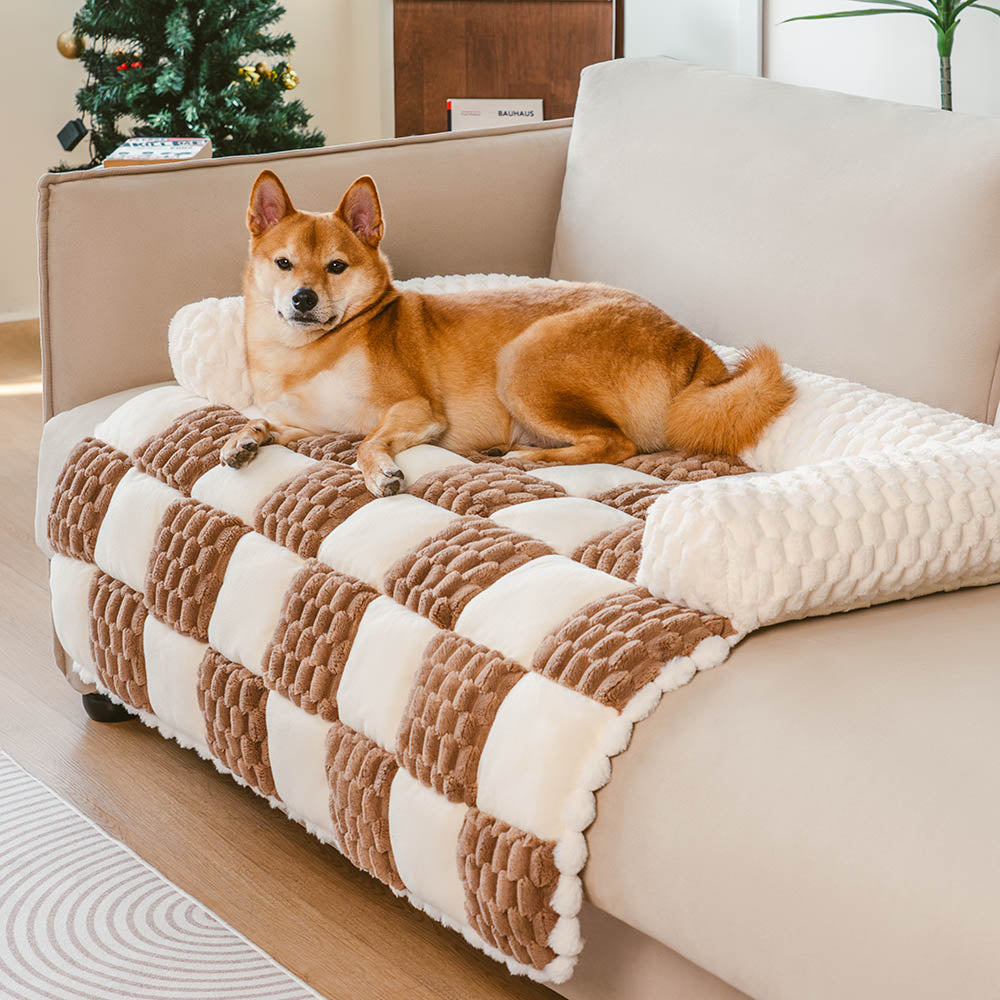 Plaid pet bed sofa protector on a couch, protecting it from pet hair and scratches
