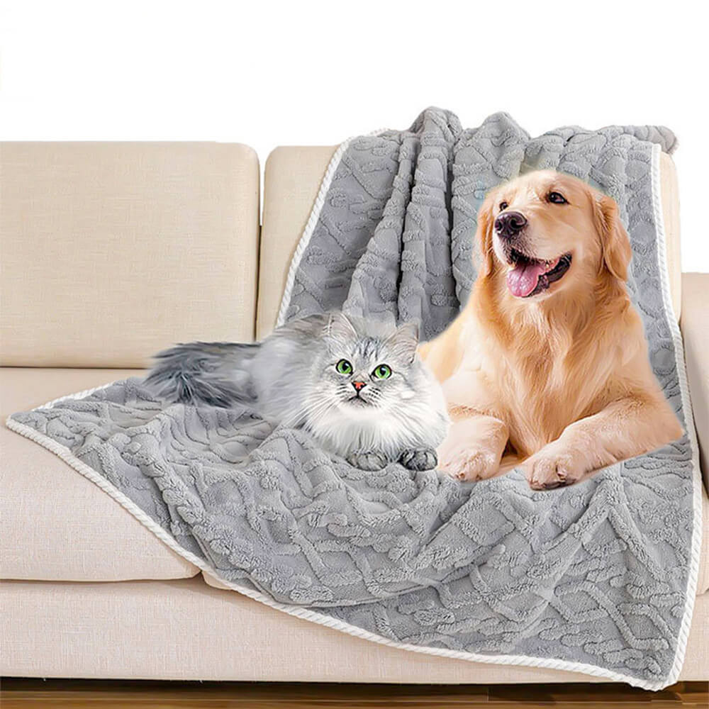 CozyPolar Fleece Dog Blanket on a couch, protecting it from pet hair and spills