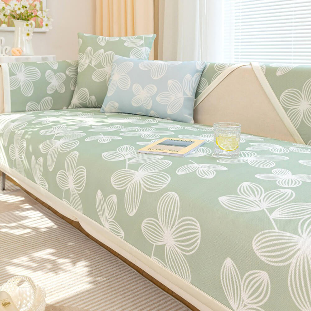 PetalCool Ice Silk Couch Cover in floral design on a sofa with pets