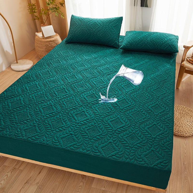 Close-up of quilted waterproof mattress protector showing plush surface and waterproof layer
