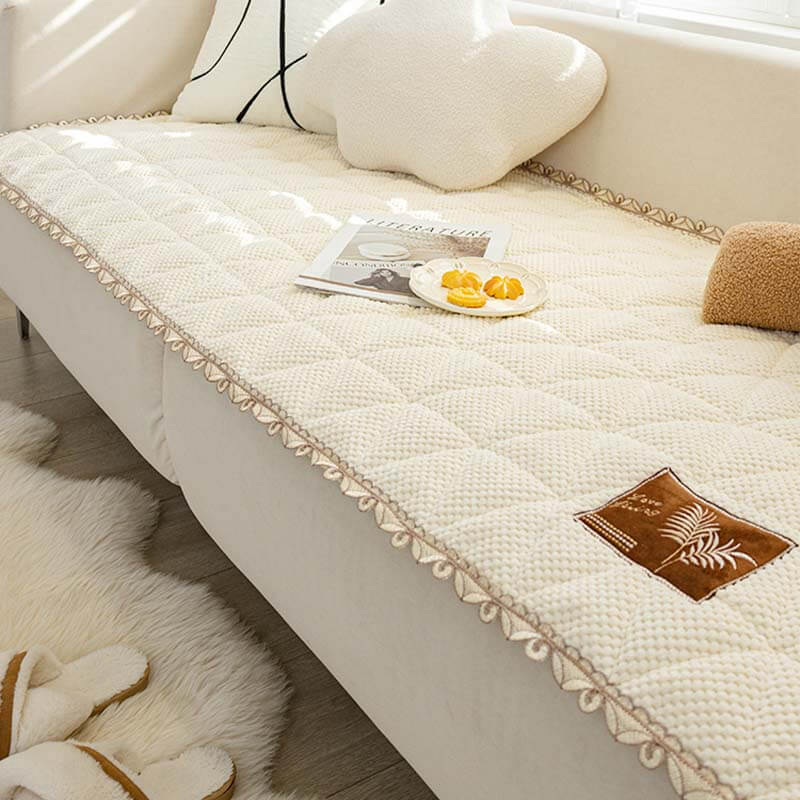 Front view of the Chenille Comfort Non-Slip Sofa Cover on a couch, highlighting its plush texture.