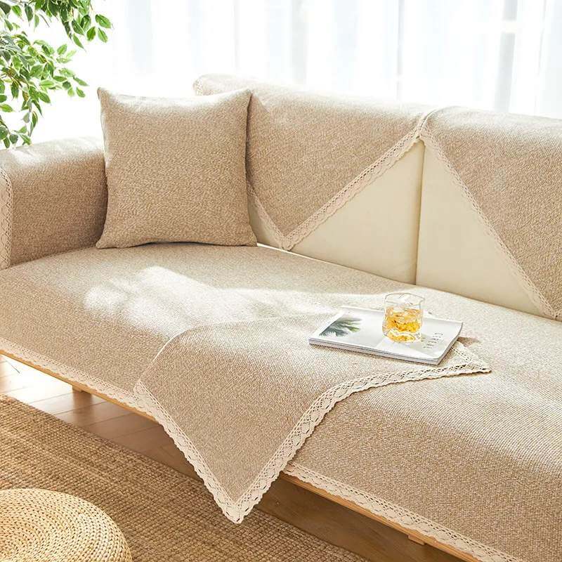 Close-up of handwoven cotton linen fabric slipcover on modern sofa, showcasing artisanal craftsmanship