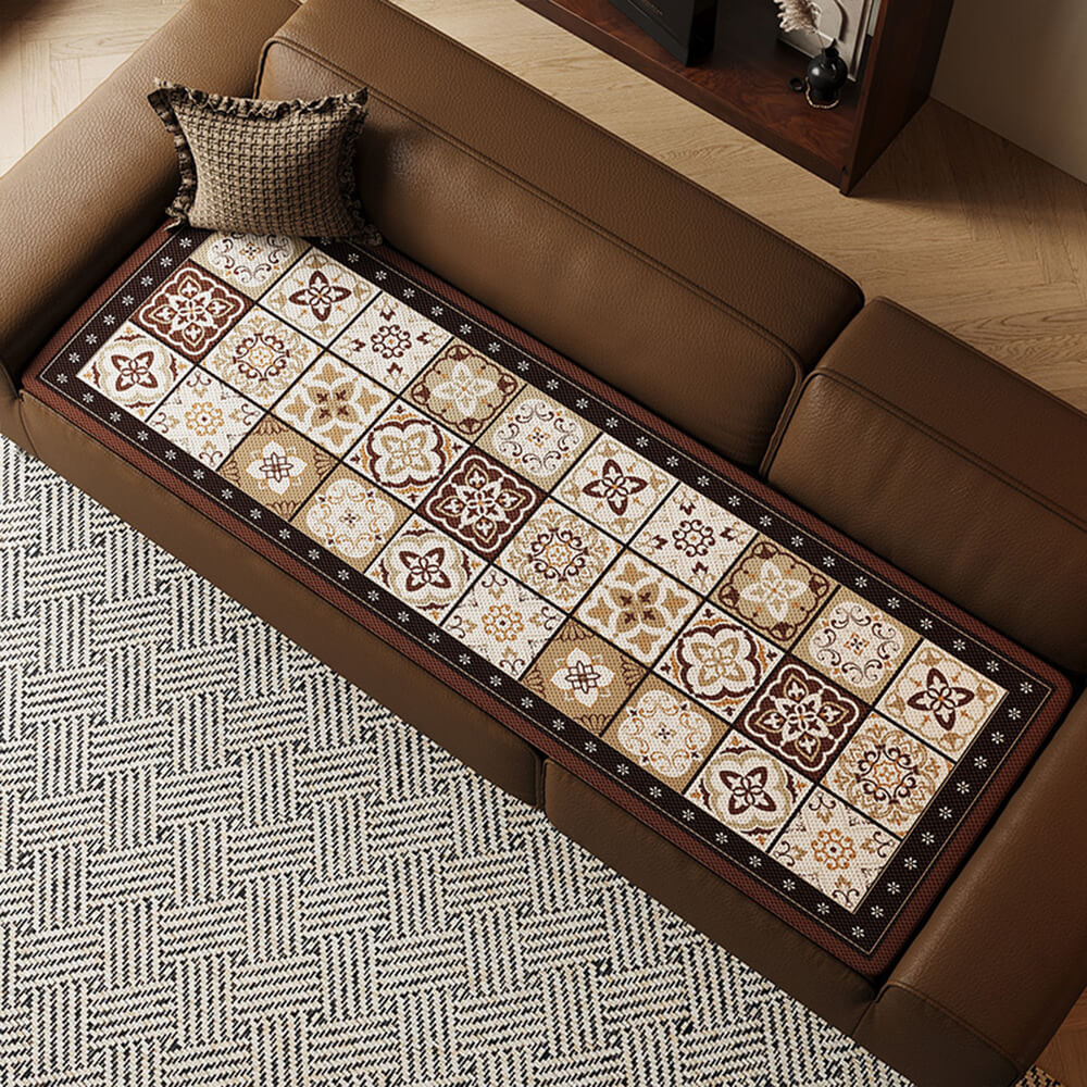 Chic Bohemian Ice Silk Couch Cover draped over a sofa, showcasing its elegant design and cooling fabric.