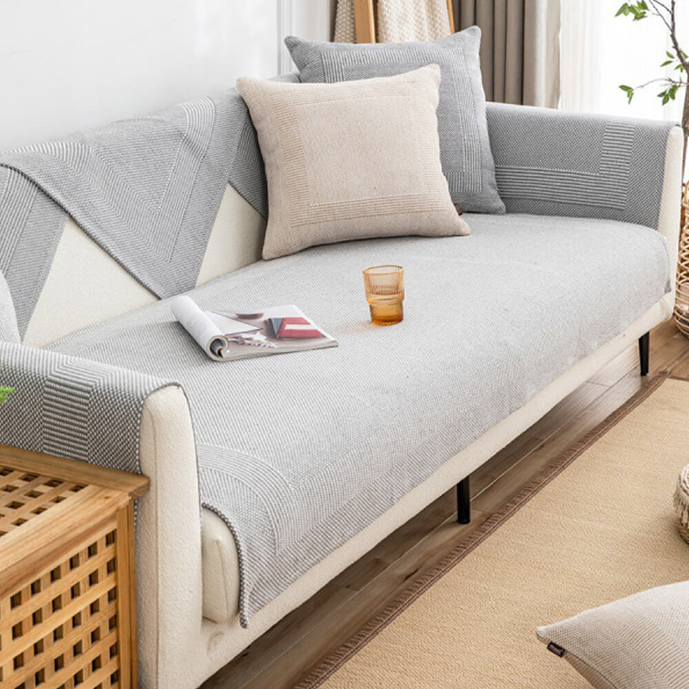 Premium linen couch protector draped over a modern sectional, showcasing its stylish texture and fit.