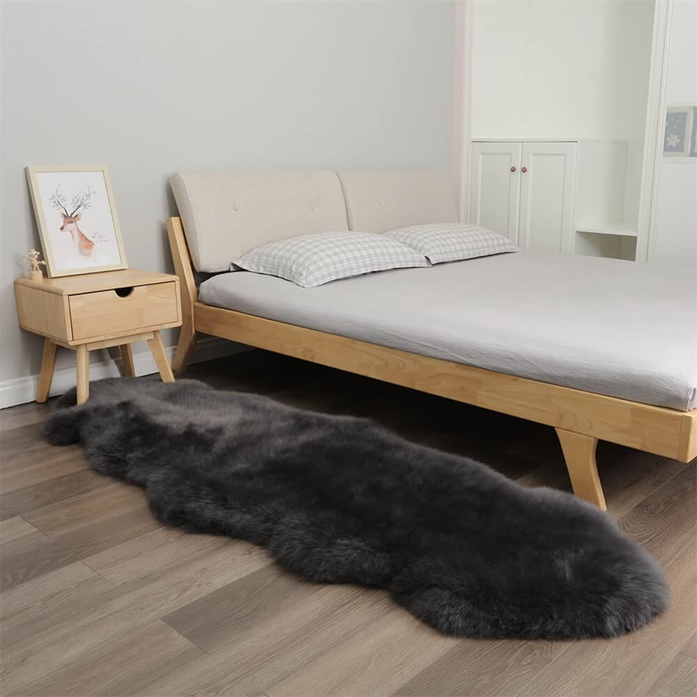 Plush cashmere rug in a cozy bedroom with soft lighting.