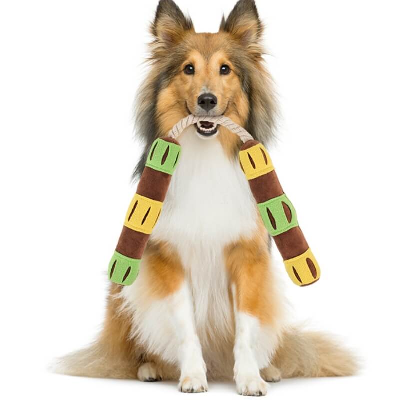 Close-up of the treat dispenser showing multiple hidden compartments on the interactive dog toy