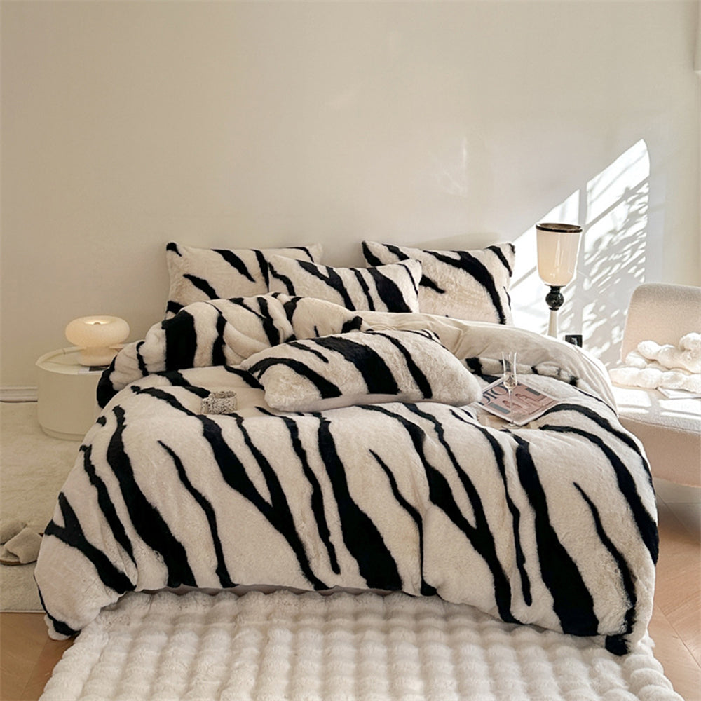 Zebra Luxe Fluffy Faux Fur Bed Sheet Set on a beautifully styled queen bed with pillows.