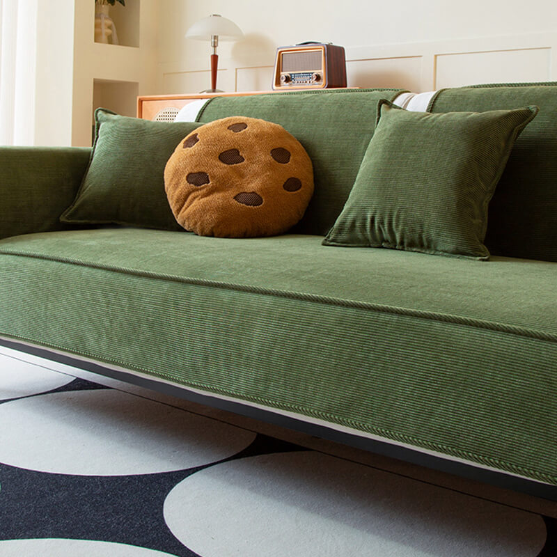 Corduroy sofa cover protecting a couch from pet scratches