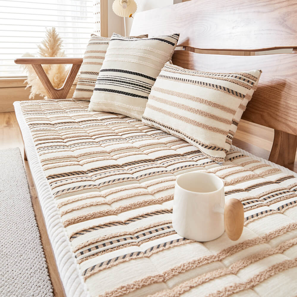 Close-up of cozy chenille striped pet couch cover on sofa showing plush texture and pattern