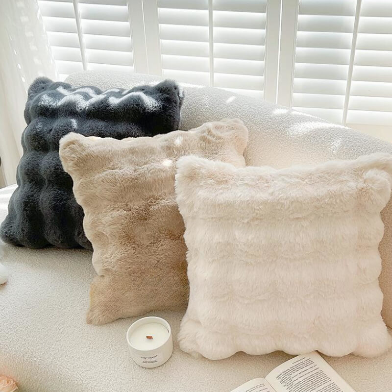 CozyReversible Luxe Plush Sofa Pillow on a modern couch, showcasing its soft plush fabric
