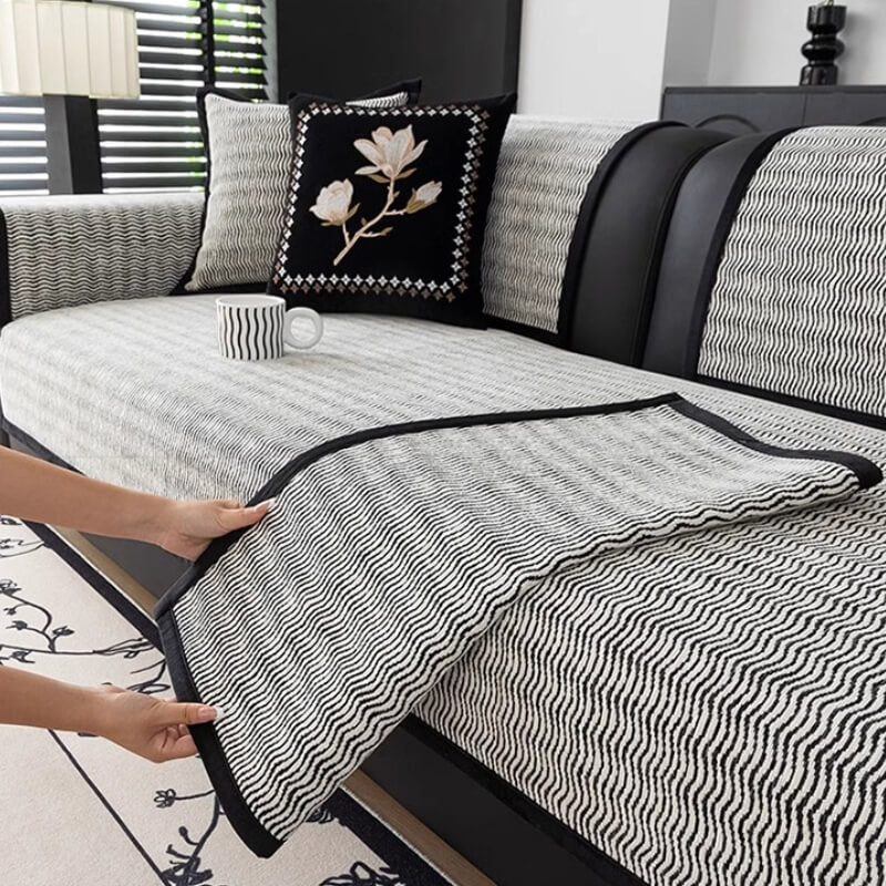Luxury chenille couch cover draped over a stylish sofa, showcasing its elegant texture.
