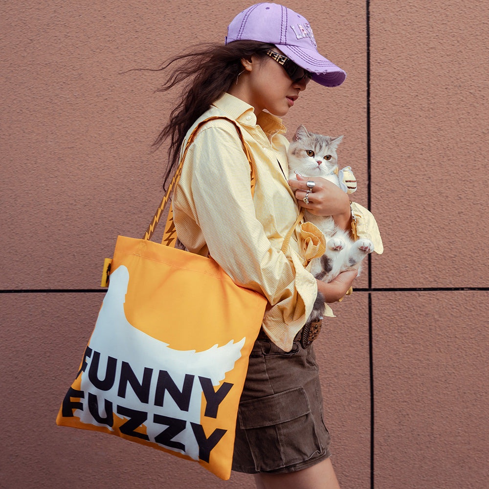 GreenPaws Recycled Canvas Tote Bag filled with groceries, showcasing its sturdy shoulder strap and spacious interior.