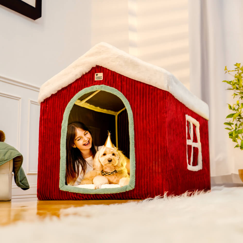 Front view of a beautifully decorated, large dog house with memory foam, featuring a festive wreath and garland, perfect for Christmas.