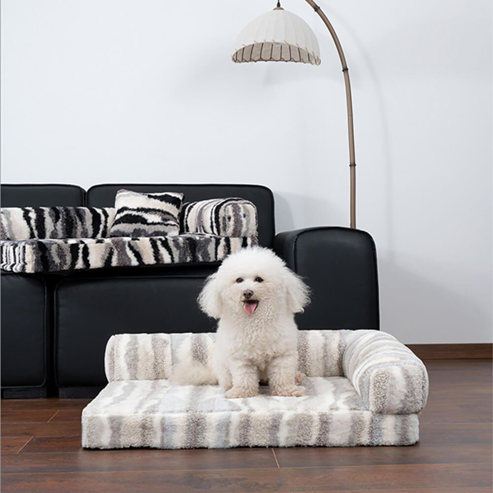 Zebra-pattern orthopedic dog bed showing plush texture and removable cover.
