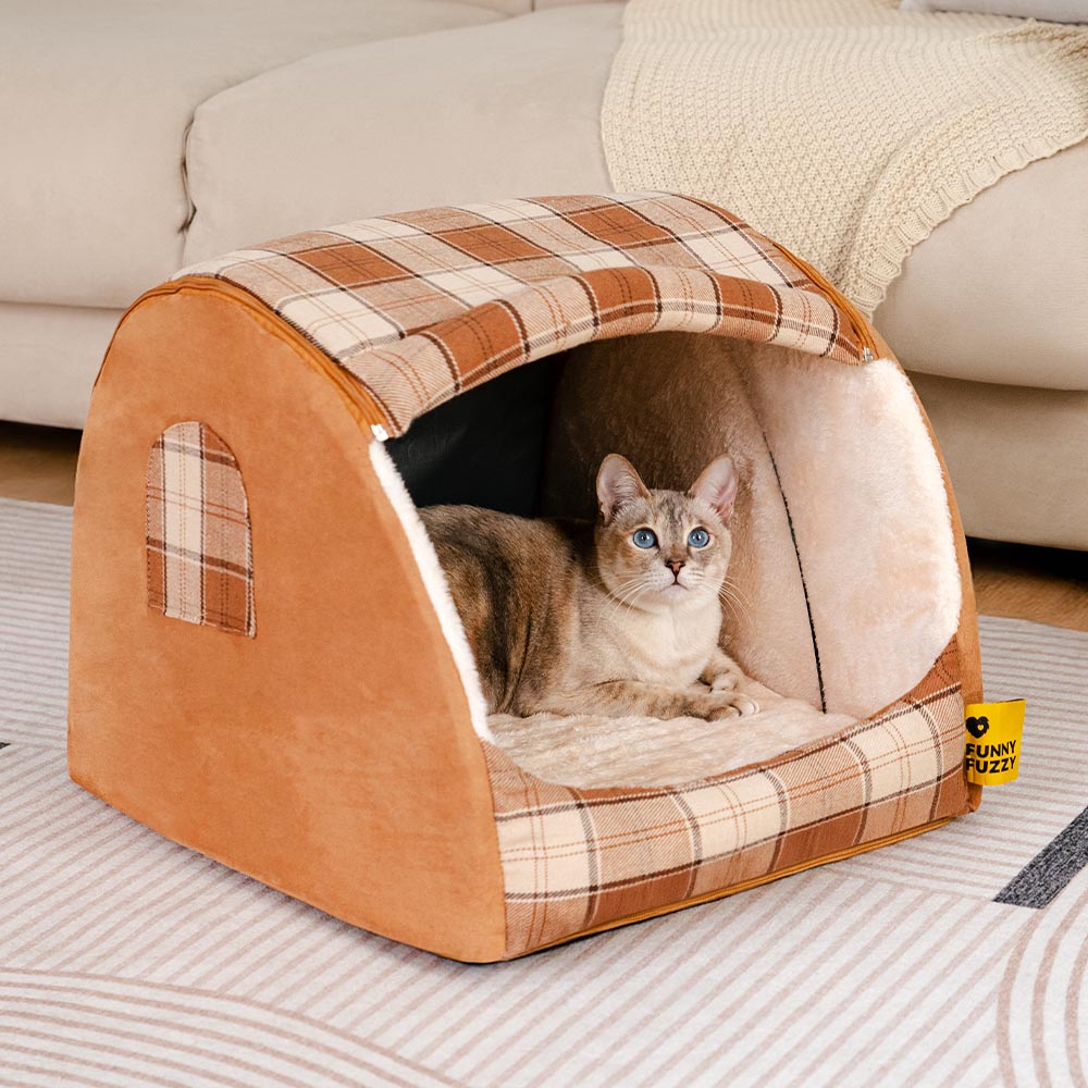 Cozy plaid cat bed in a rustic cabin setting, showing arched den design
