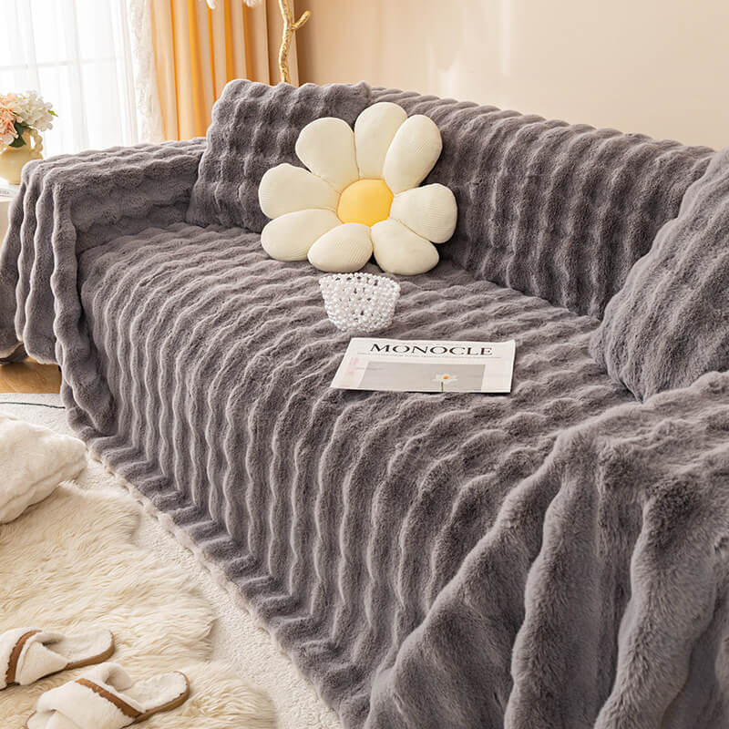 Luxurious faux fur couch cover on a modern sofa, pet-friendly and stylish protection