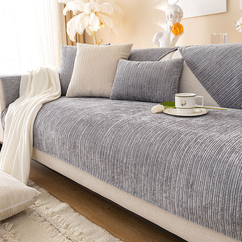 Chenille non-slip sofa cover in a stylish living room, perfect for pet owners.