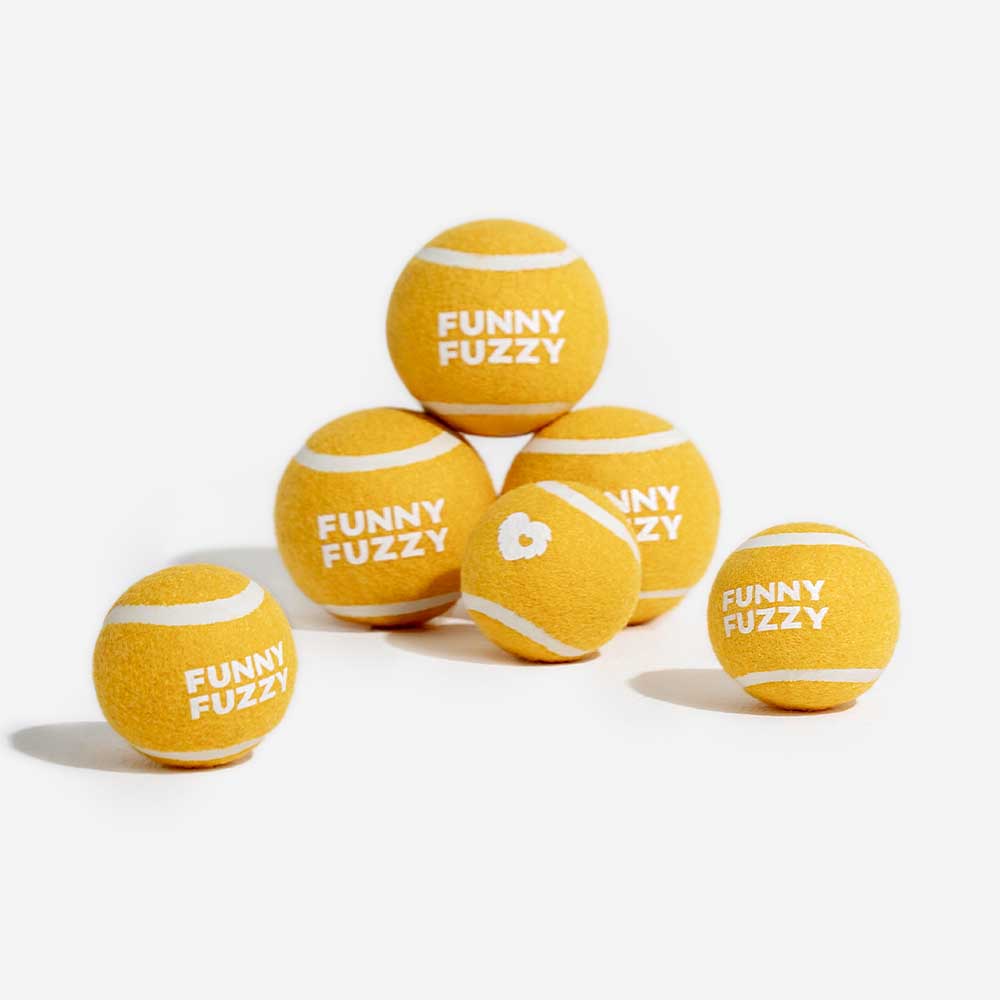 Close-up of yellow BounceBuddy squeaky dog toy showing texture and durability