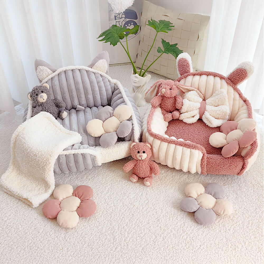 Cozy plush pet sofa bed with removable blanket and toy, perfect for small dogs and cats.