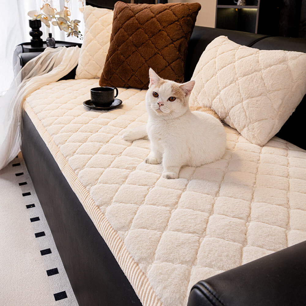 CozyPlush Diamond Quilted Sofa Cover on a couch with pets
