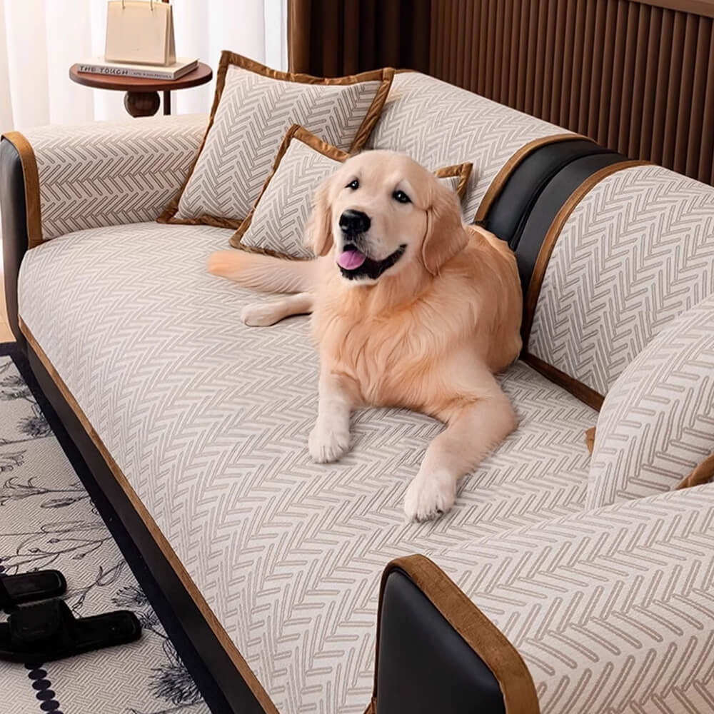 Modern herringbone couch cover draped over a sofa with a cat lounging on it