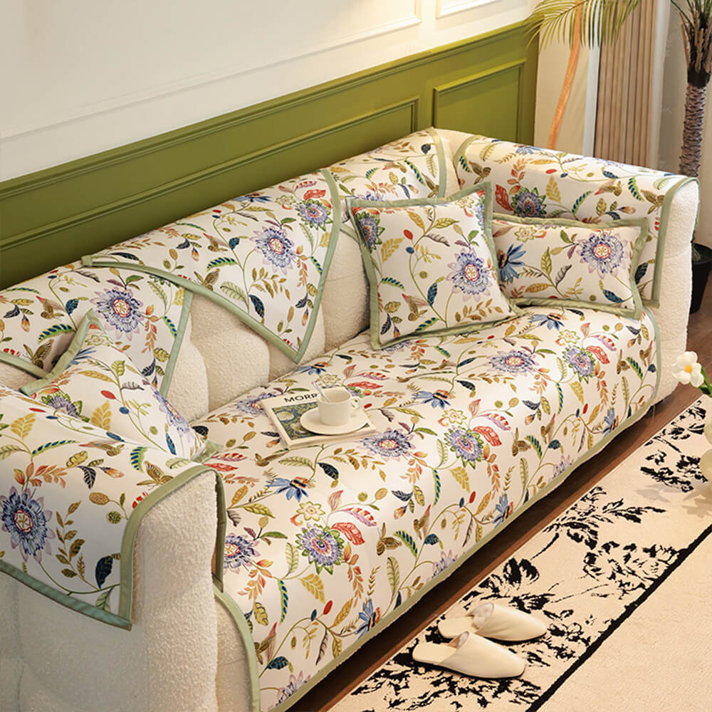 Floral cooling couch cover draped elegantly over a modern sofa