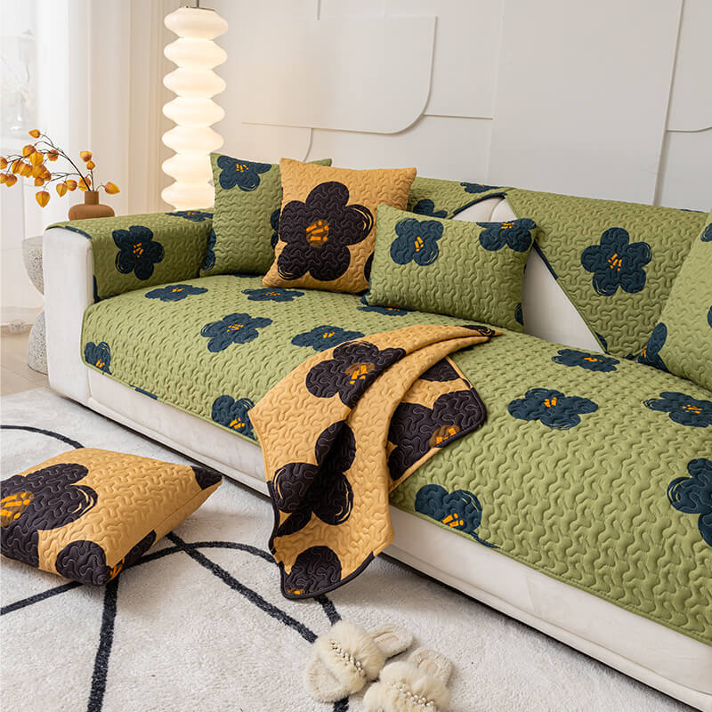 Overhead view of a Caramel Macchiato Cotton Sofa Shield draped over a neutral-colored sofa, highlighting its soft texture and rich color.