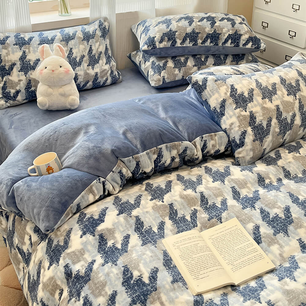 Top-down view of the Velvéra milk velvet bedding set on a queen-sized bed, highlighting the quilt cover's plush texture