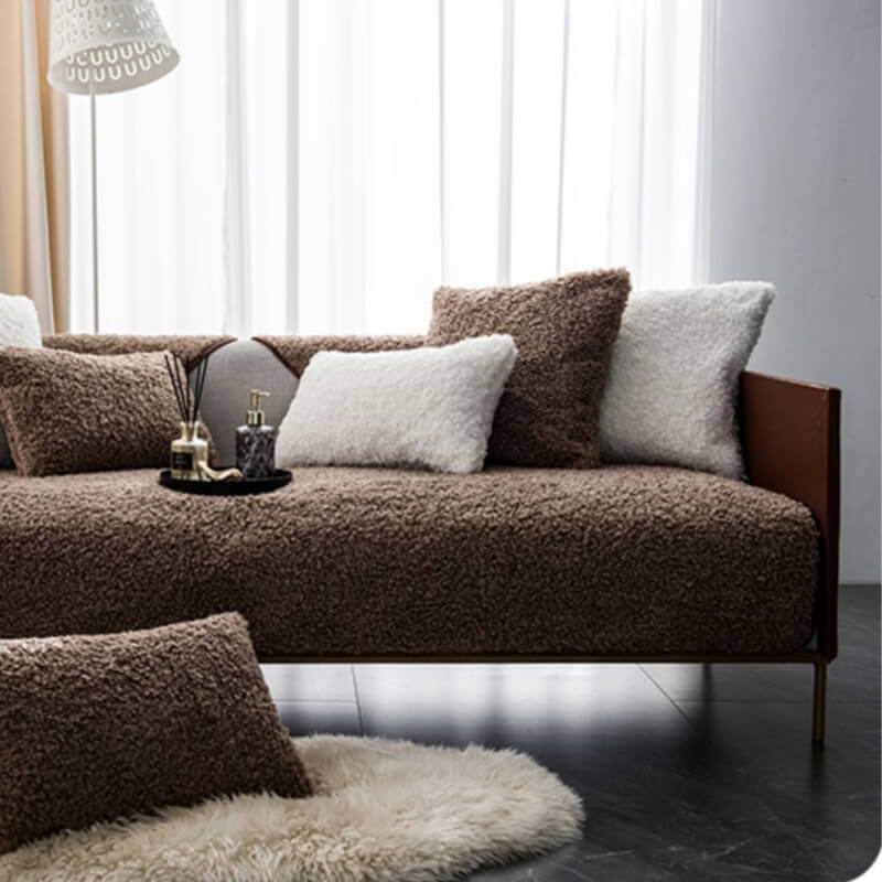 Luxury warm fleece couch cover draped over a modern sofa in rich brown