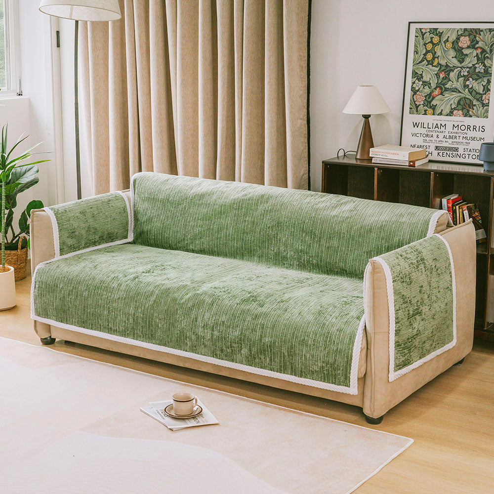 Front view of the chenille pet rug used as a couch cover with furniture protector function