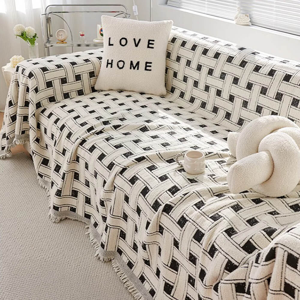 Luxury checkered sofa cover draped elegantly over a modern living room couch