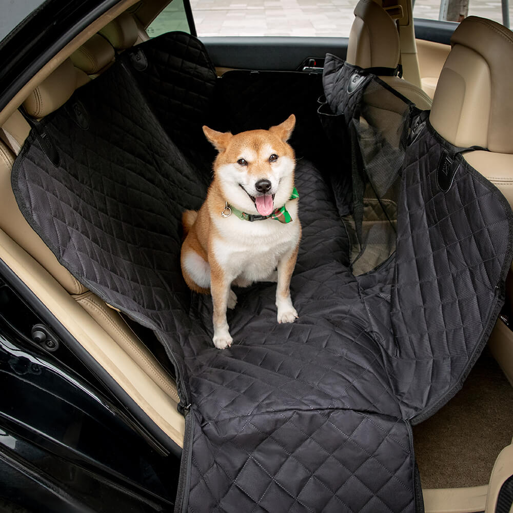 Wide-angle view of scratch resistant dog cover secured in SUV back seat