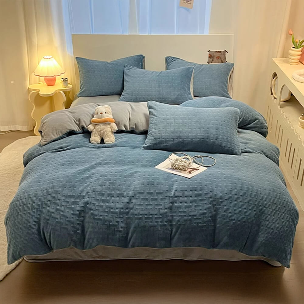 Luxury milk velvet bed sheet set on a bed, showcasing its soft, plush fabric and elegant woven texture.