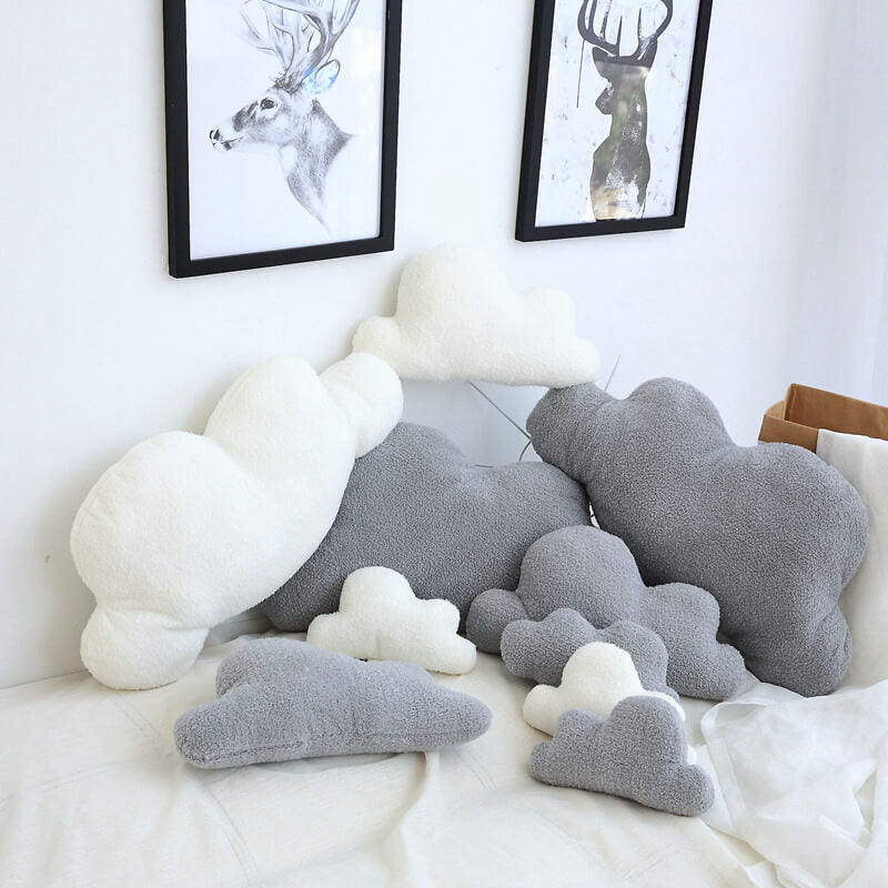 Charming cloud pillow on a sofa, perfect for relaxation.