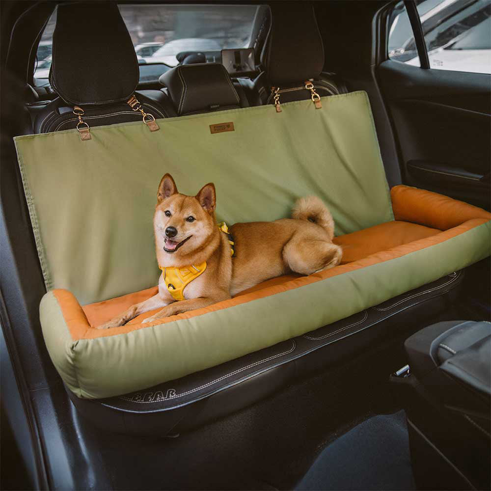 Close-up of waterproof dog seat protector with anti-slip straps in a car interior