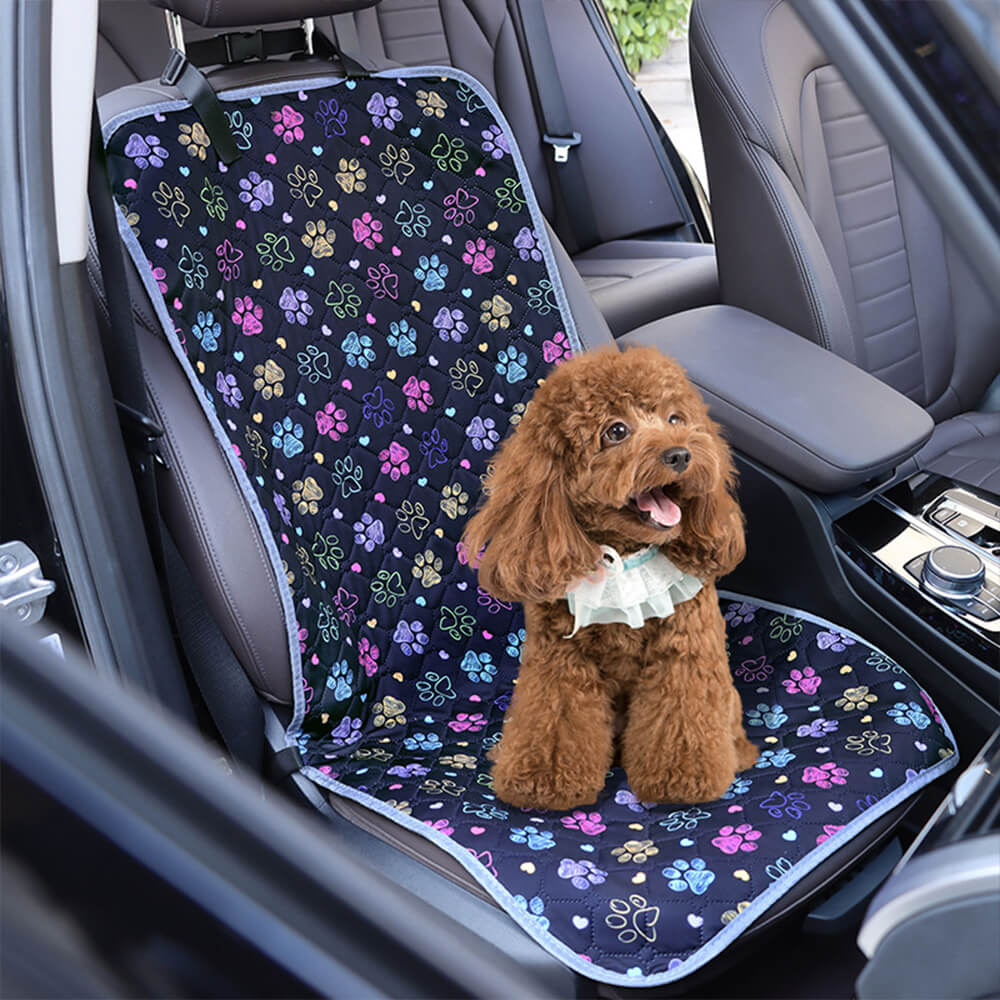 Dog enjoying a comfortable ride on the waterproof pet cover