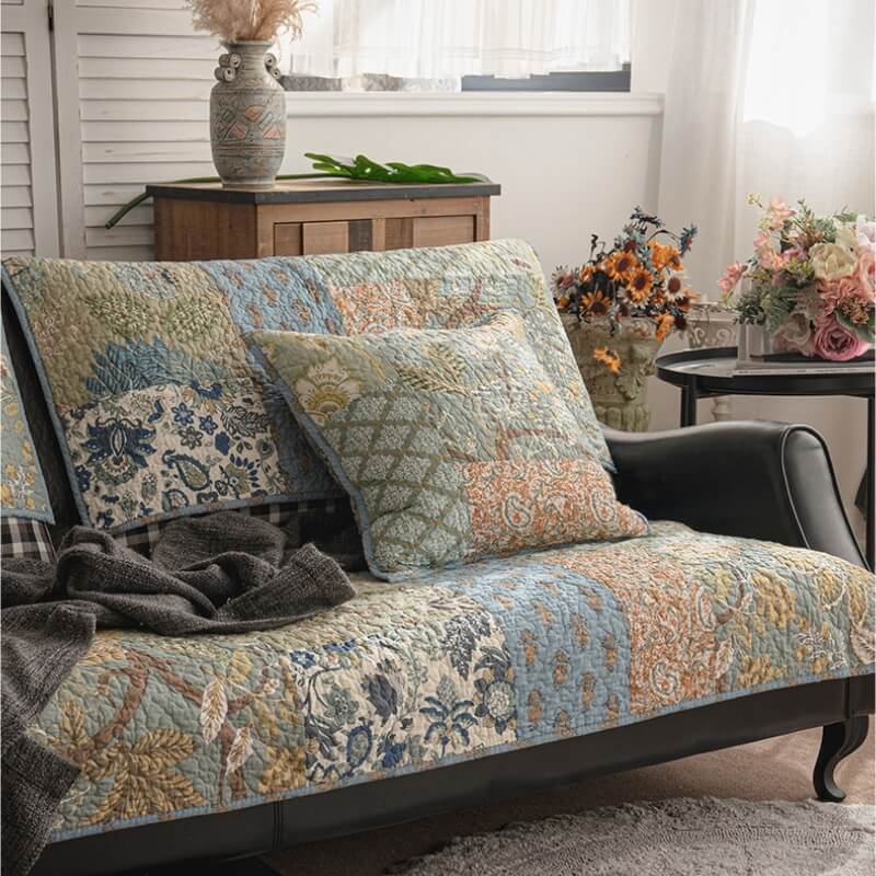 European floral sofa cover draped elegantly over a modern couch