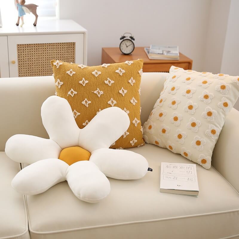 Front view of the Daisy Bloom pillow showcasing embroidered daisies and soft texture