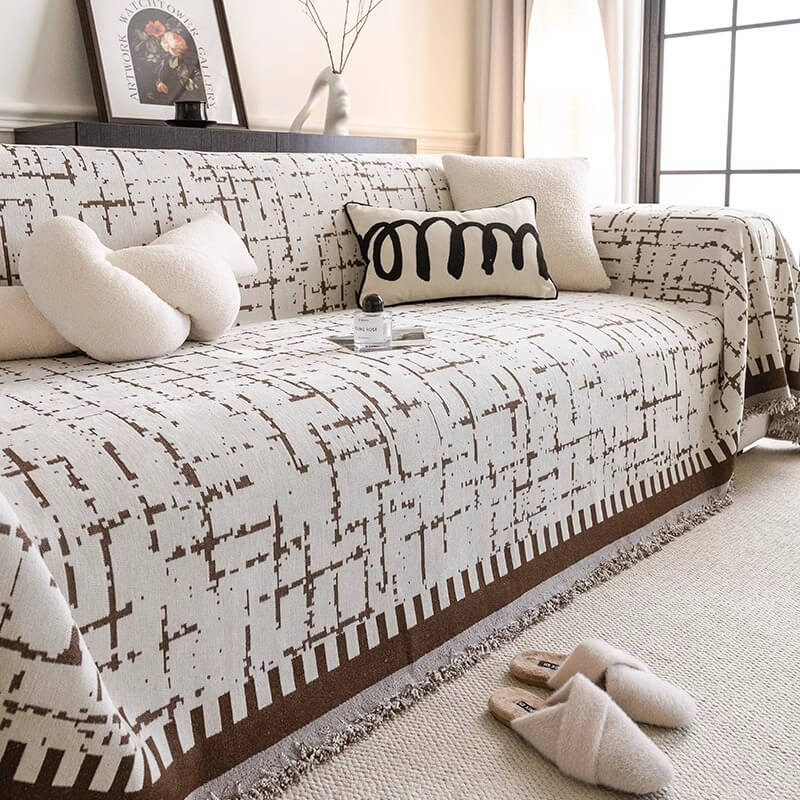 Close-up of anti-scratch chenille fabric on a sofa cover, durable pet proof couch cover for cats and dogs