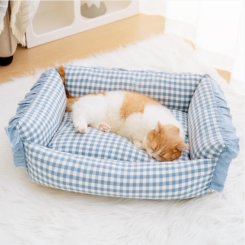 Cozy Ruffle Plaid Detachable Pet Bed from above, showcasing its plush surface and soft cotton material.