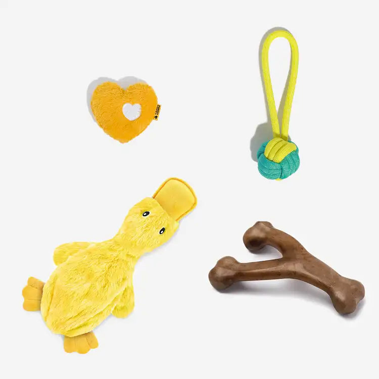Squeaky plush duck toy being squeezed by a happy dog