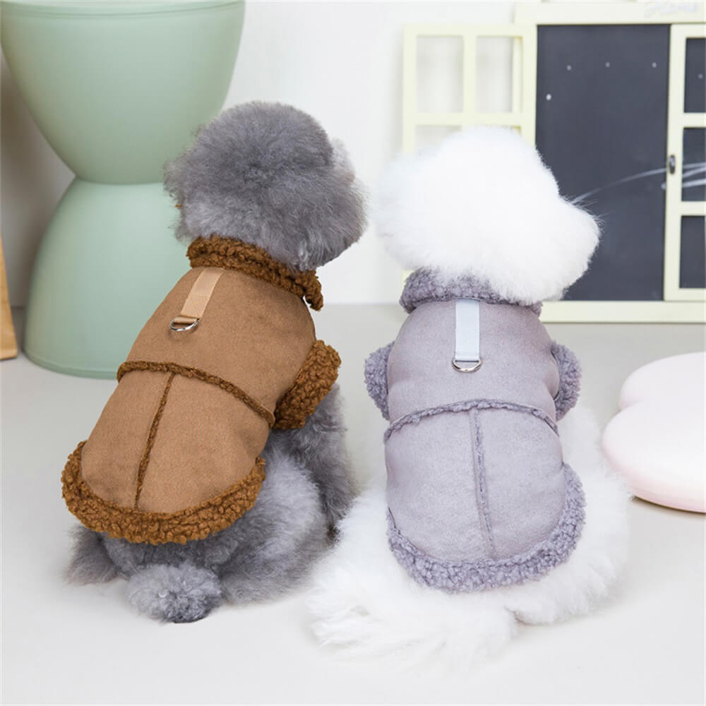 Dog modeling the shearling jacket in grey, showcasing the harness attachment