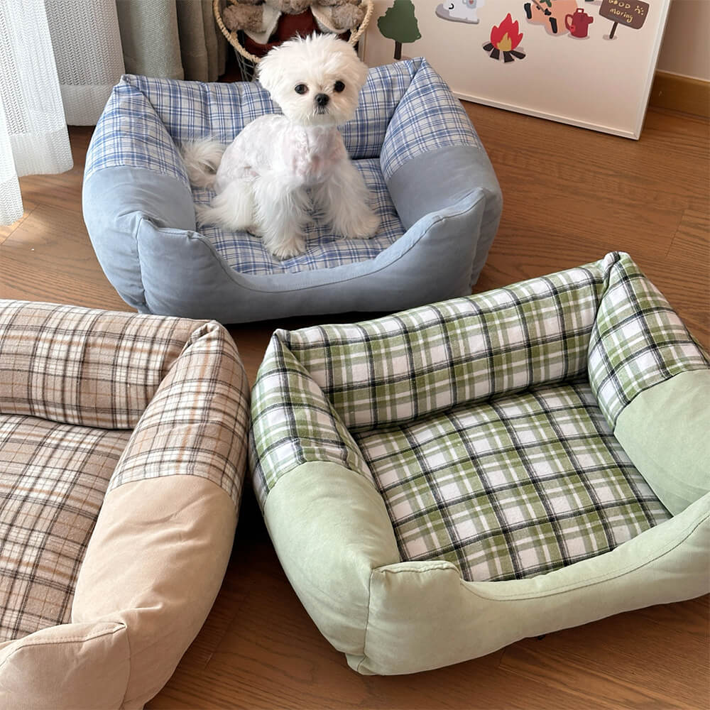 Gingham bolster pet bed with raised edges for comfort and support