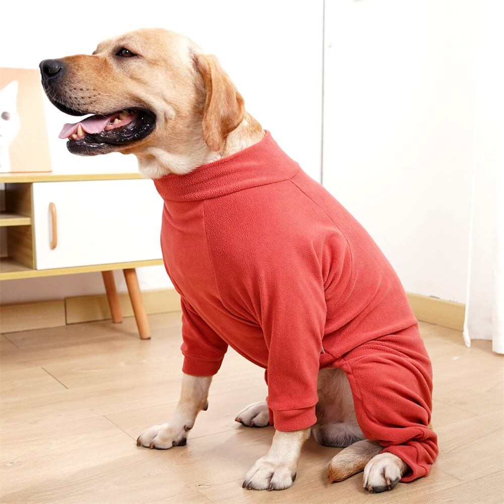 Large dog wearing SnuggleSoft fleece pajamas while lounging indoors
