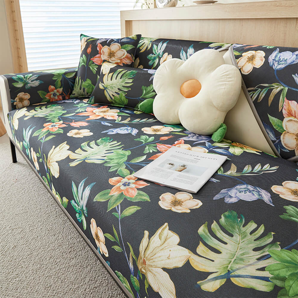 Close-up of tropical leaves cooling ice silk sofa cover showing vibrant pattern and breathable fabric