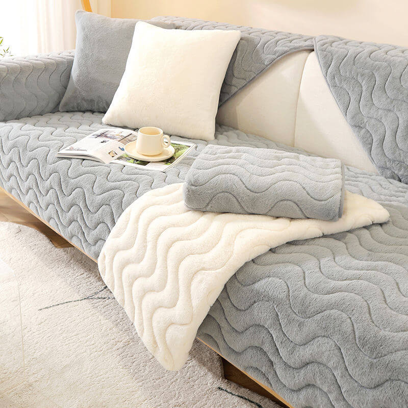 Front view of plush couch cover with wave pattern and snug fit on a sectional sofa