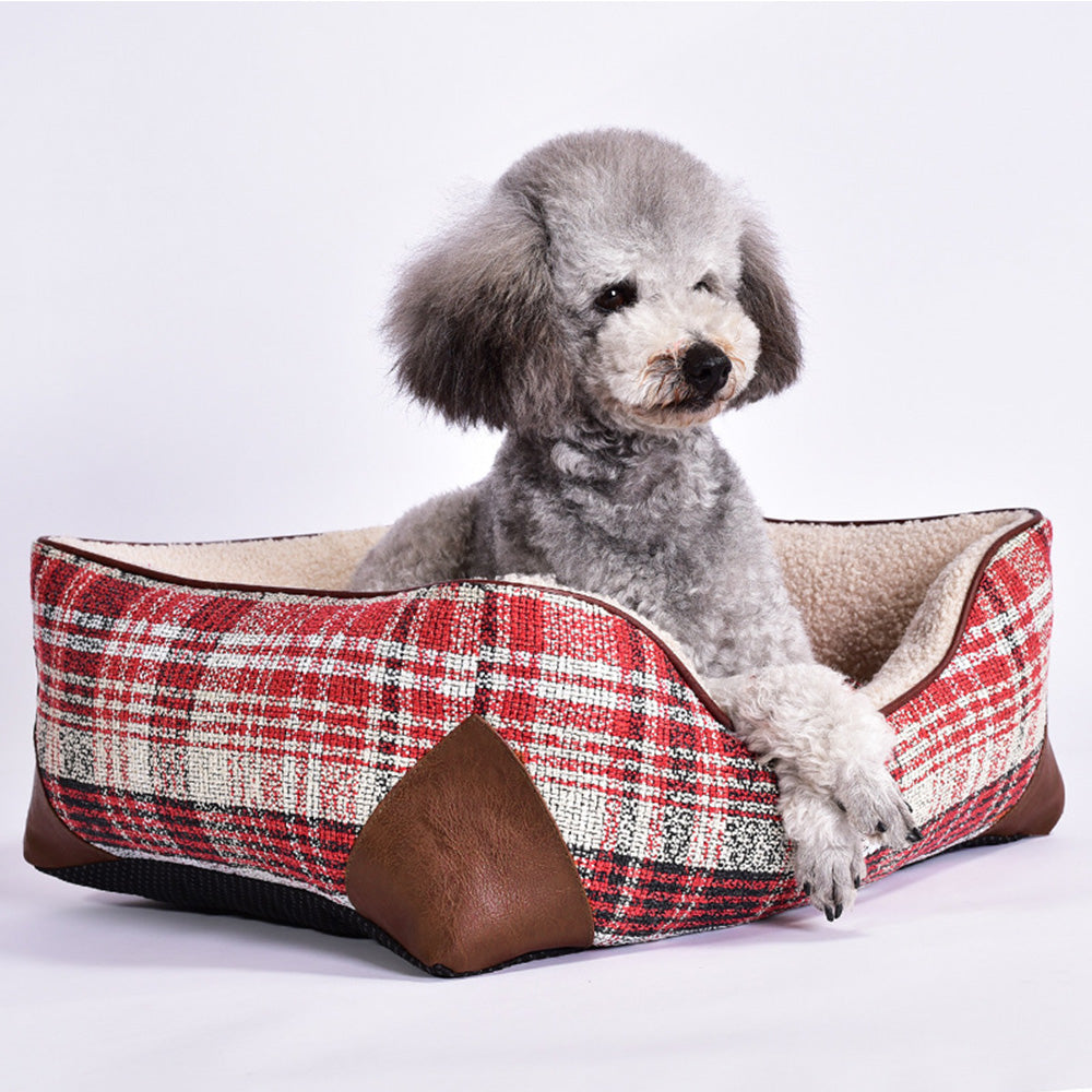 Close-up of vintage plaid faux sherpa pet bed with leather trim