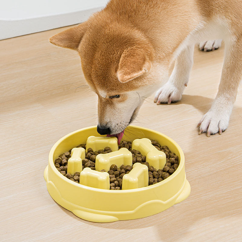 Top-down view of the slow feeder dog bowl showing the lemon yellow maze pattern