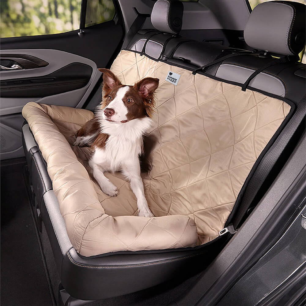 Top-down view of dog seated in PawsAway car seat cover for dogs, showcasing edge cushions